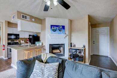 Charming fireplace and LVF flooring in entry flowi