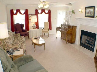 Spacious Den with gas log fireplace, tile surround