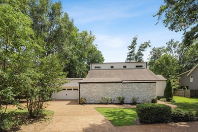 View of front facade featuring a garage and a fron