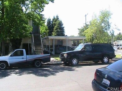 Car port and part of the apartment building.