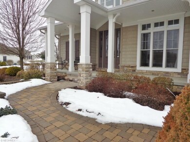 Notice the paverstone front walkway leading to the