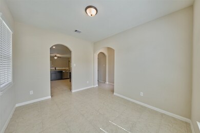 Formal dining leading to the kitchen.
