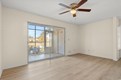 Unfurnished room featuring ceiling fan and light w