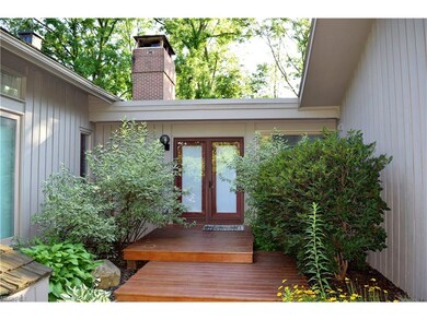 Entry view in private courtyard with French doors 