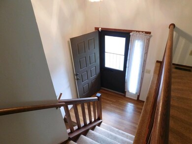 Front door with sidelight brightens the entry.