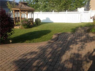 Exterior Back Fully fenced in yard with charming G