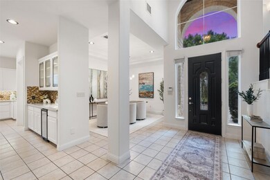 Entryway with light tile patterned floors, recess