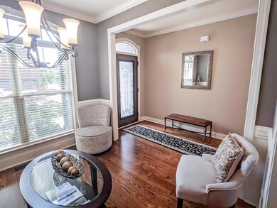 Entryway leading into the formal dining room.  Solid Oak Hardwood flooring on all main level.