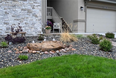 Front Bubbling boulder welcomes guests