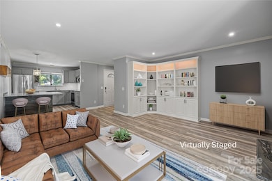 Spacious, open-concept layout seamlessly connecting living, dining, kitchen for comfortable daily living and easy entertaining.