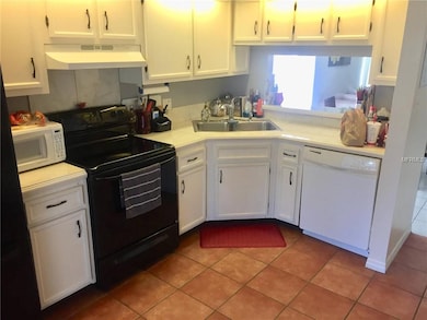 KITCHEN. PARTIAL VIEW. TILED COUNTER TOPS