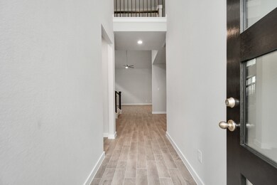 The grand entrance beckons with high ceilings, ado