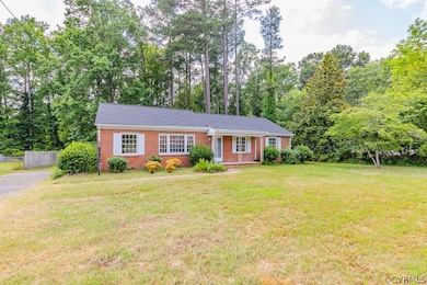 Ranch-style home with a front lawn