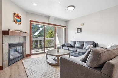 Living room with 9' wide sliding door and gas fire