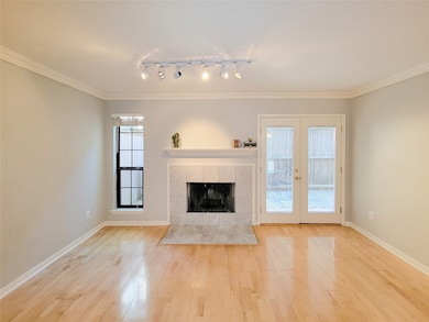 Elegant fireplace with marble surround and wood ma