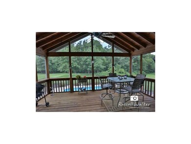 Screened in Deck overlooks the pool and provides c
