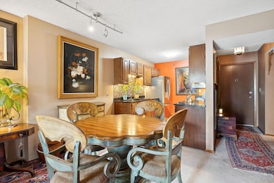 Dining & kitchen area with front entry to the right