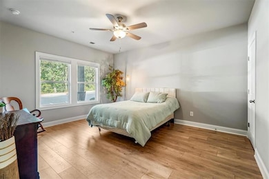 Bedroom featuring light wood-style floors and ceiling fan