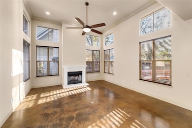Unfurnished living room with a fireplace with rai