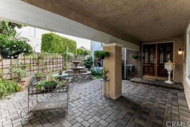 Private courtyard with pavers and fountain