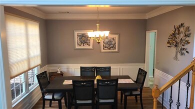 Dining area featuring dark wood-type flooring, vis