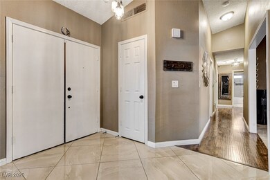 Foyer entrance, double doors with large tile floor