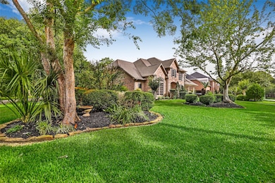 Corner lot with view from corner. Lush lawn, matur