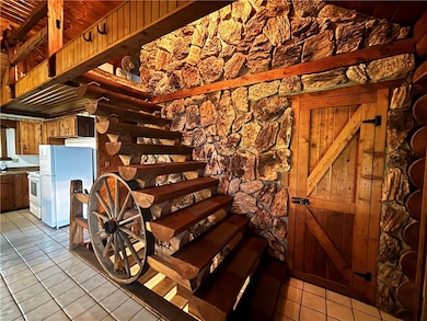 Beautiful Entry with log steps and stone work