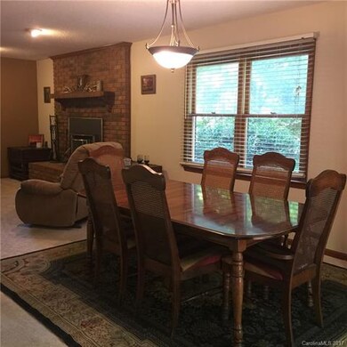 Dining room offers sliding glass door onto rear de