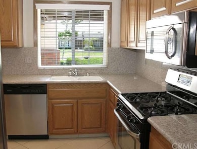 New built-in stainless appliances including free-standing range/oven.