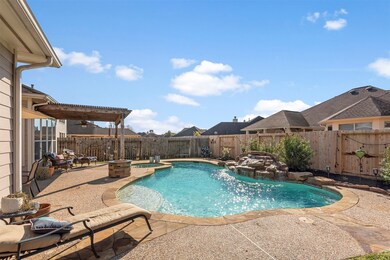 The rock waterfall feature creates a lovely ambiance.  This is such a relaxing space.