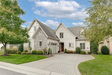 View of front facade with a garage and a front law