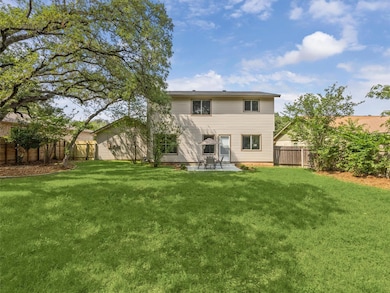 Rear view of property featuring a patio area and a fenced backyard