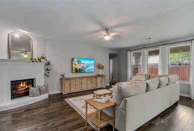 Stone fireplace, hardwoods, 9 foot ceilings and bright windows make this an inviting space.