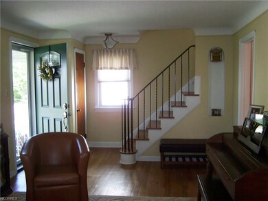 Large, inviting living room with gorgeous hardwood