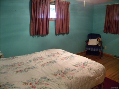 Bedroom with hard wood floors