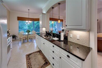 Kitchen with see-through to the living room and ad
