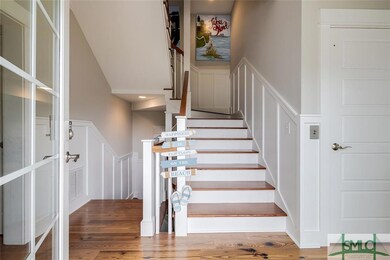 Entrance showing stairs with elevator on the right