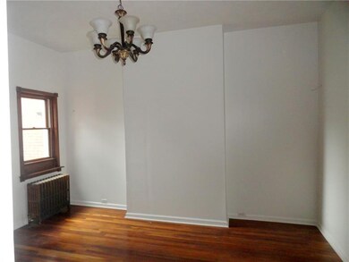DININGROOM WITH EXPOSED WOOD FLOORING.