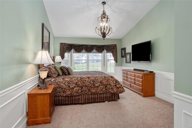 Vaulted master bedroom with a beautiful bay window