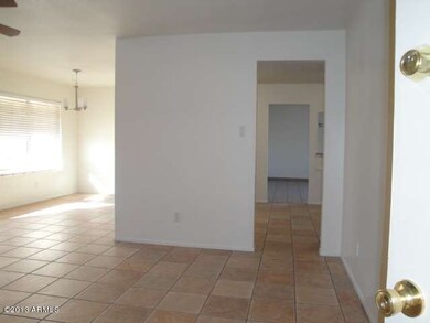 View of DR/Kitchen thru to FR from entry
