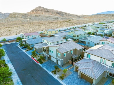 Aerial view of residential area featuring a mountain backdrop