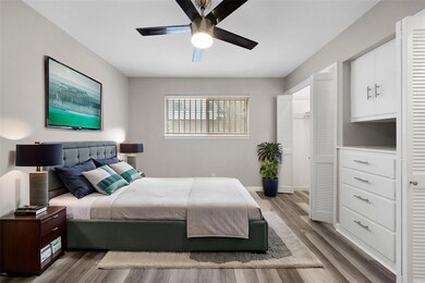 Bedroom featuring light wood-type flooring and cei