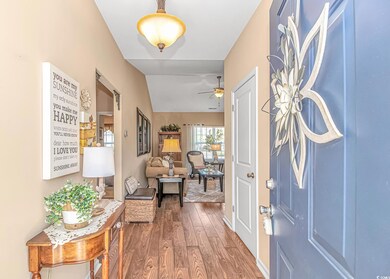Foyer entrance featuring lofted ceiling, ceiling f