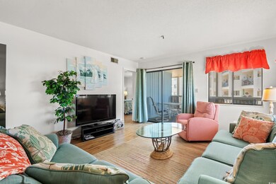 Living room featuring wood finished floors and vis