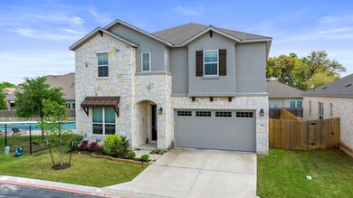 Traditional-style home featuring stone siding, a 
