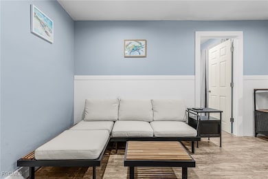 Sitting room featuring wood finished floors
