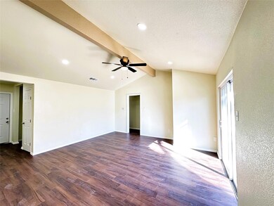 Spare room with ceiling fan, dark hardwood / wood-