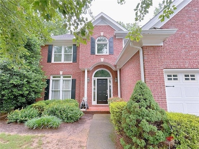 Property entrance featuring brick siding