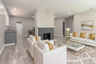 Living room, virtually staged, featuring light har